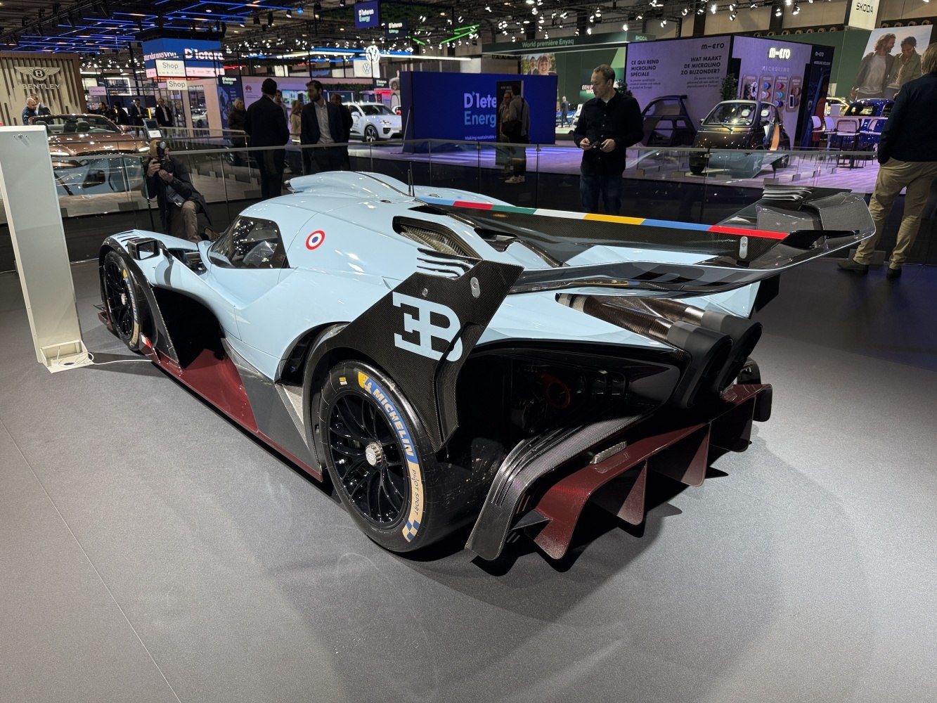 Aerodynamic rear wing with carbon fiber diffuser and sporty racing exhaust