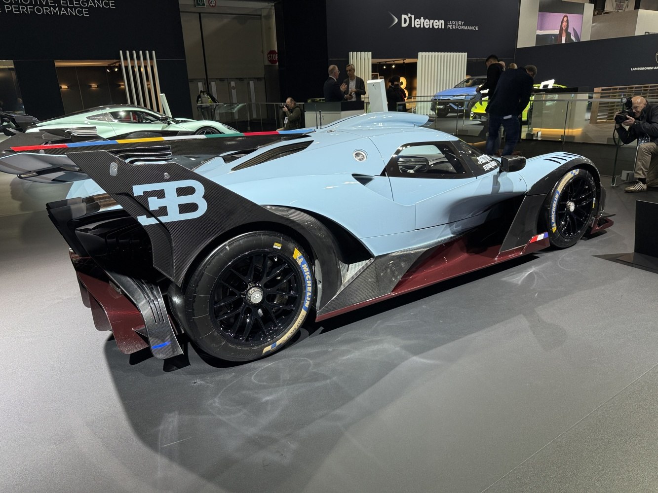 High-performance track car with advanced aerodynamic features and carbon fiber rear wing
