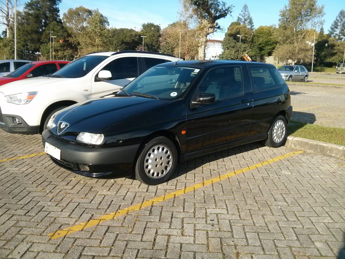Black 3-door hatchback front-side view