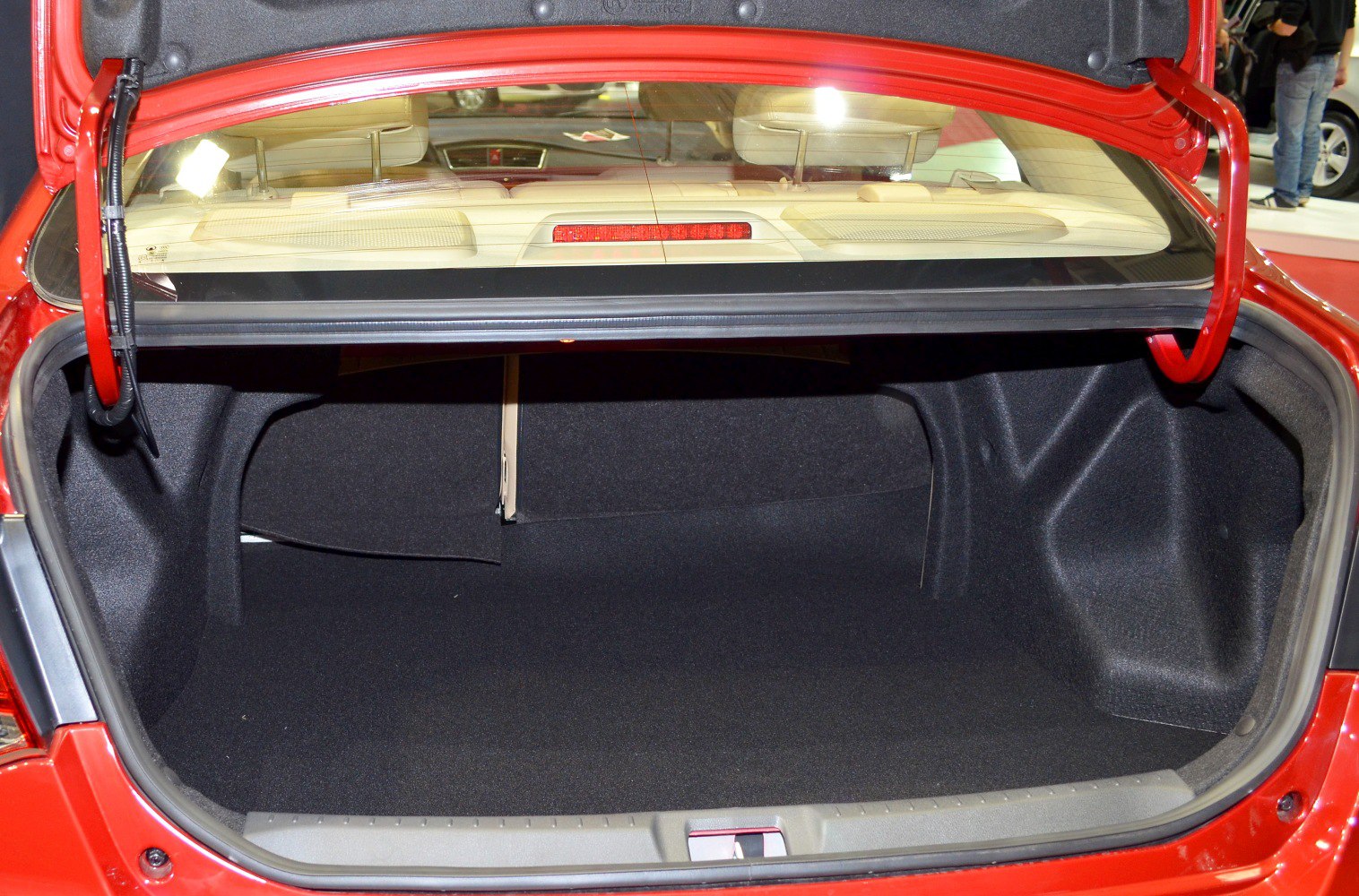 Clean, spacious sedan trunk interior with rear seat backs visible