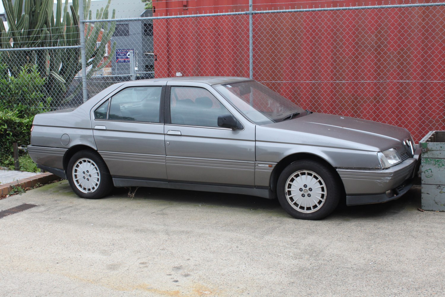 Classic sedan side profile with alloy wheels and geometric body lines