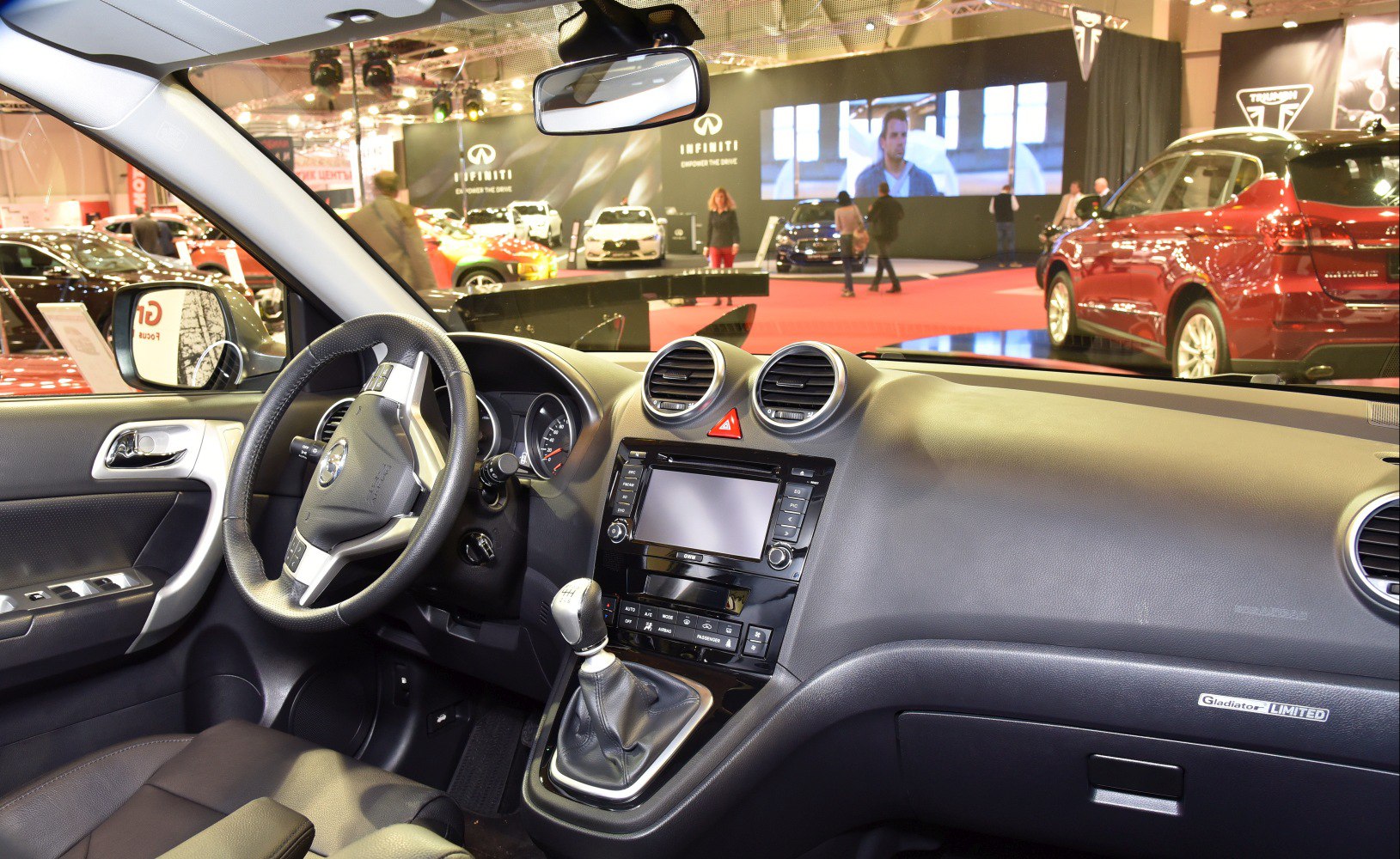Manual gear shift, circular air vents, and detailed dashboard interior