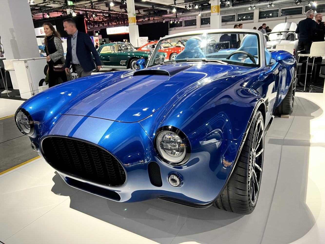 Blue convertible with classic curves and modern LED round headlights