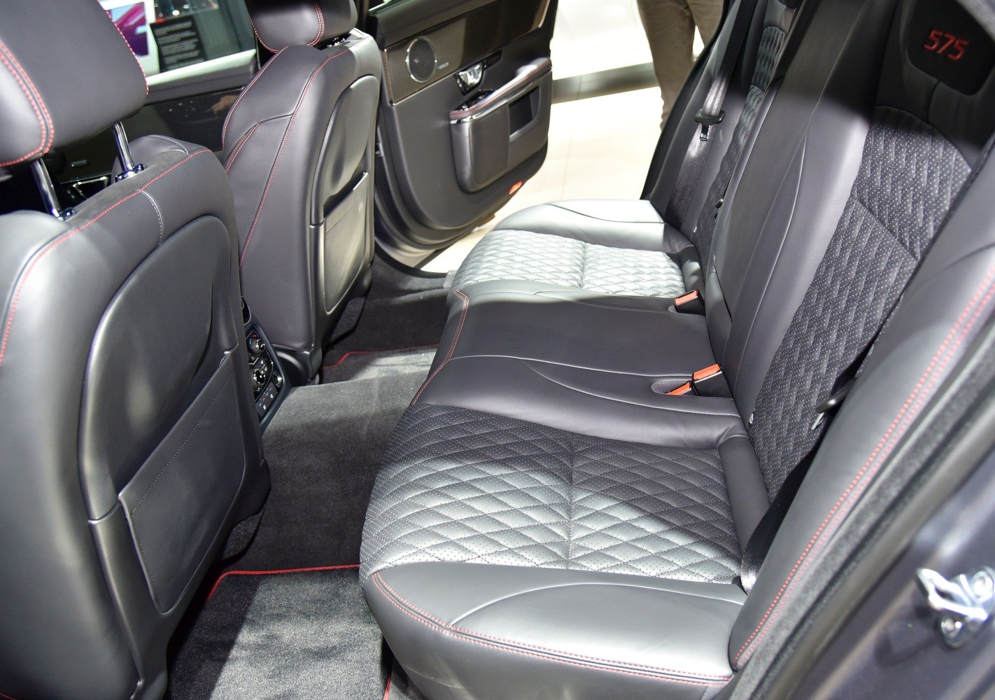 Quilted leather rear seats with red stitching and spacious legroom
