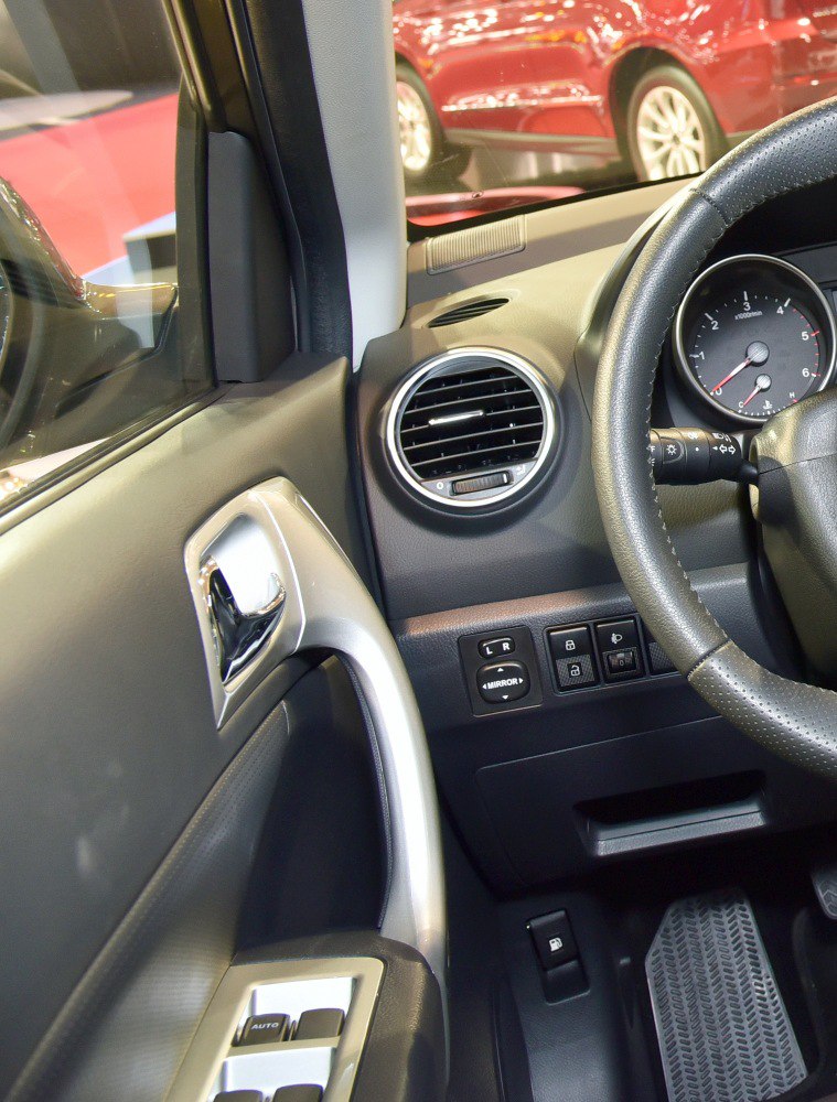Dashboard air vent, door handle, control buttons in car interior
