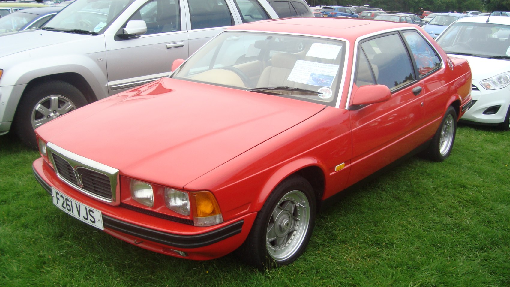 Front exterior view of a classic 1980s sports coupe with square headlights and chrome grille