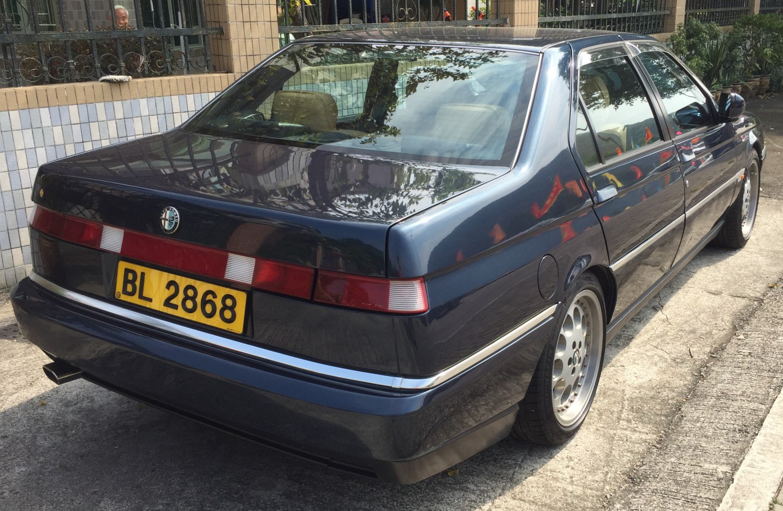 Rear view with classic taillights and polished alloy wheels