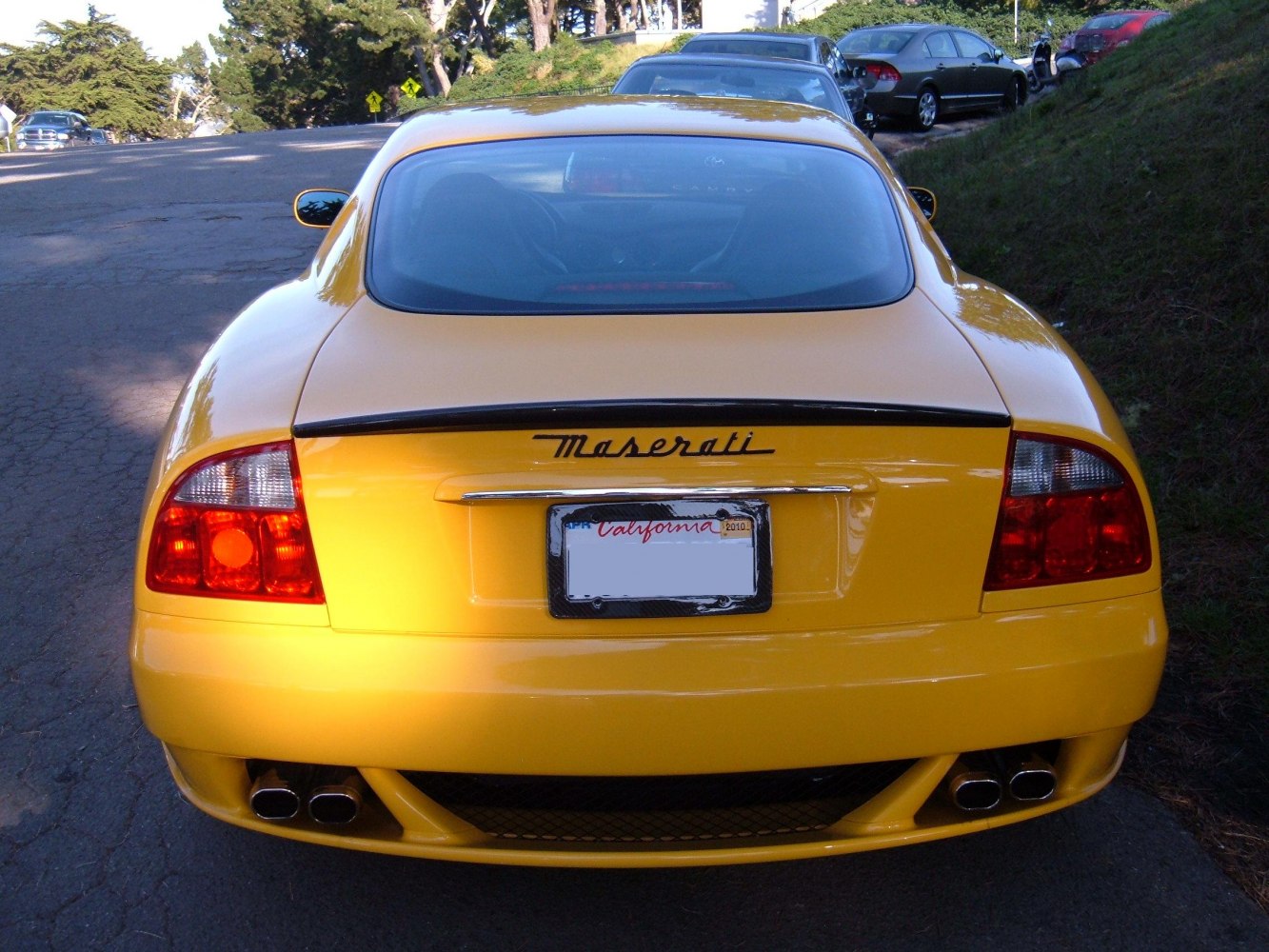 Rear view with quad exhausts and taillights