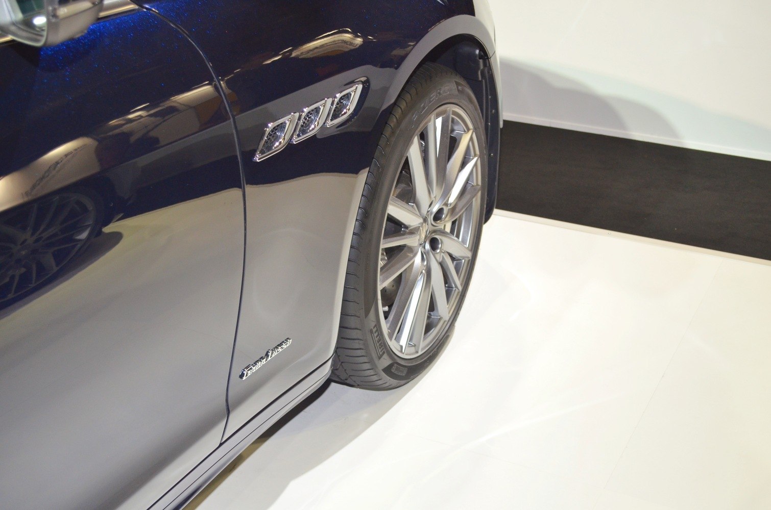 Side vent and alloy wheel of a luxury sedan