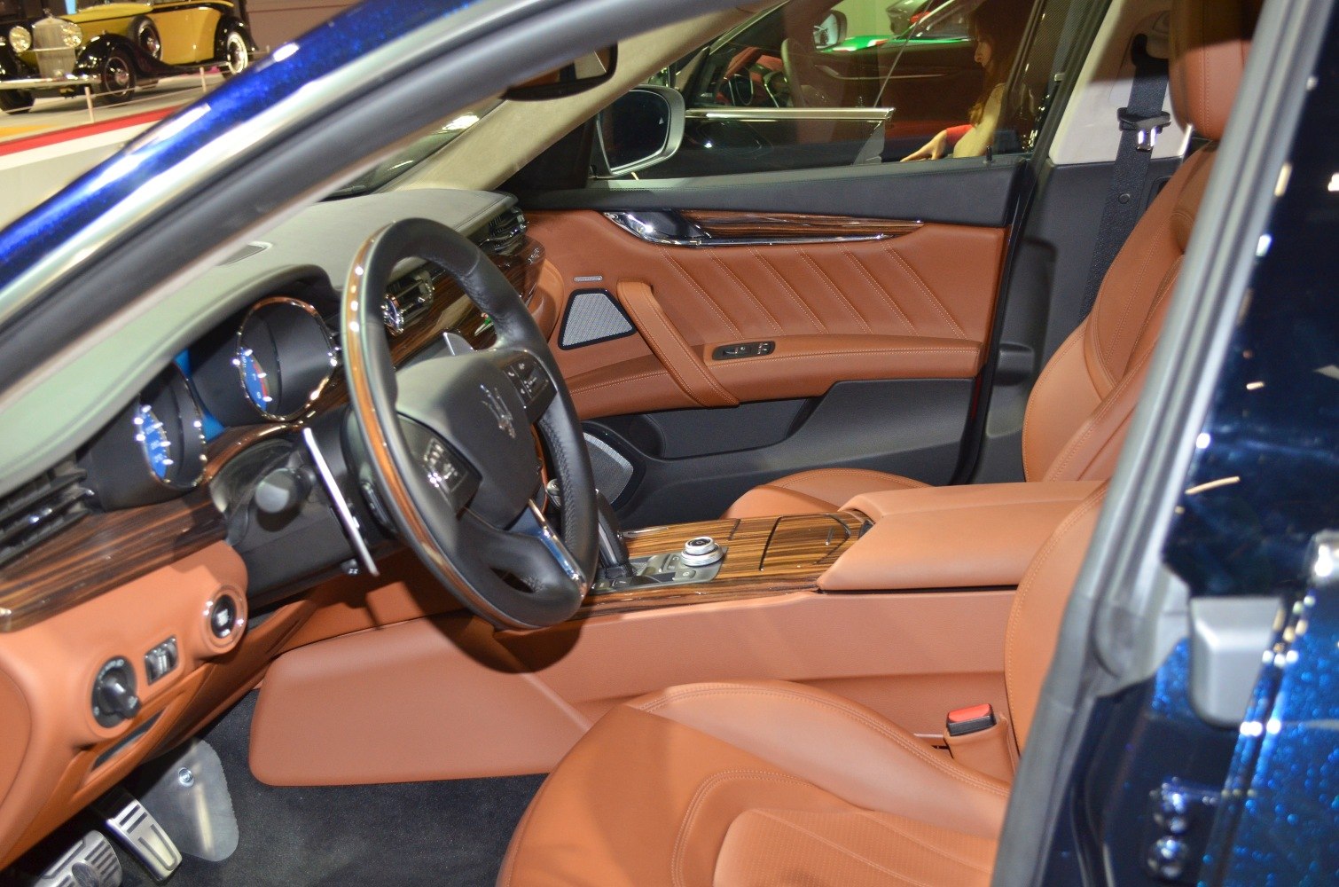 Luxury brown leather seats and wood trim interior with modern dashboard controls