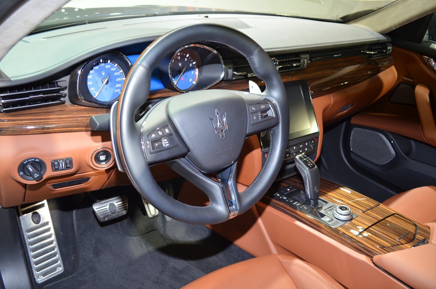 Luxury steering wheel and wood trim interior with digital display