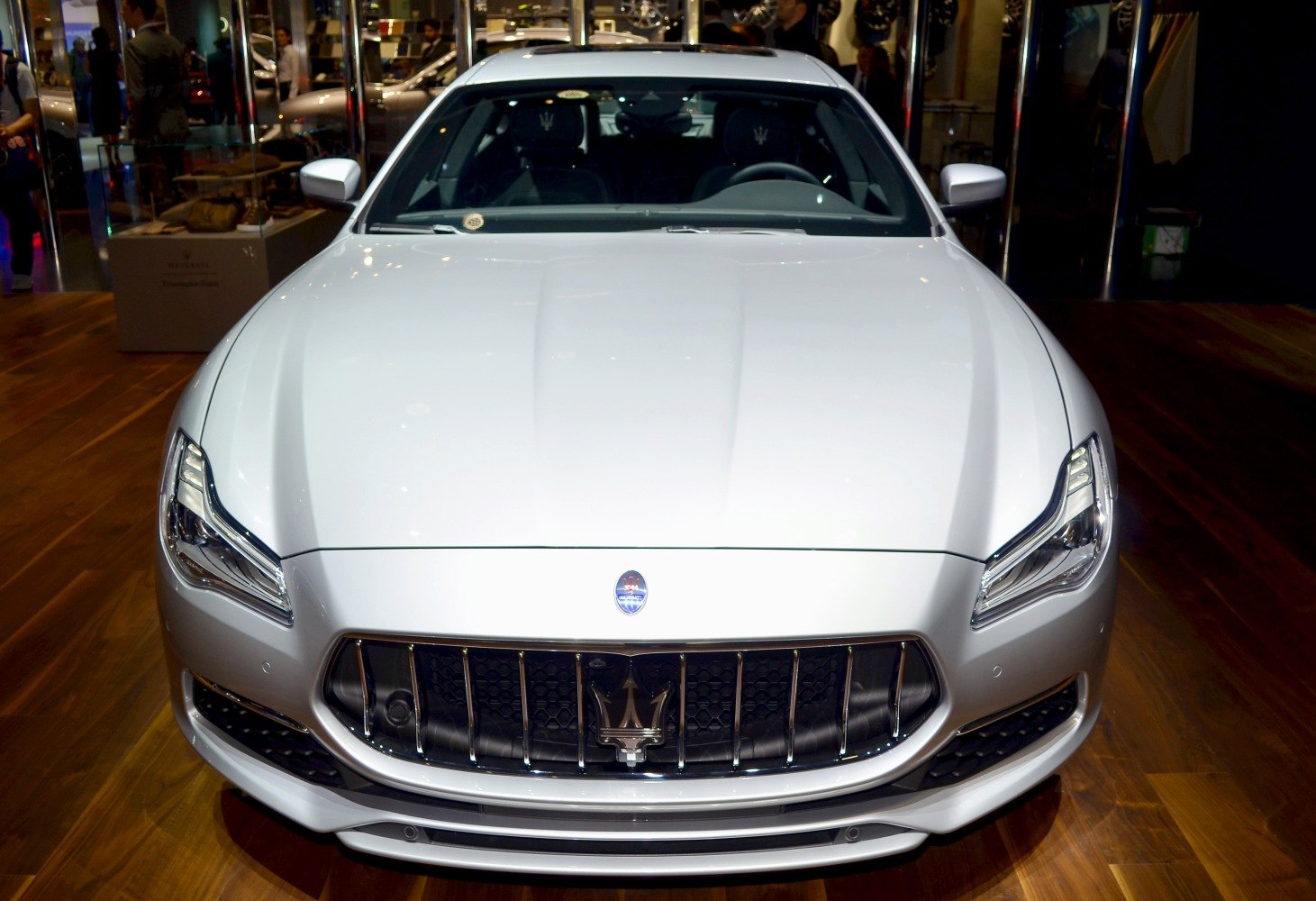 Front view of luxury sedan with iconic grille and modern headlights