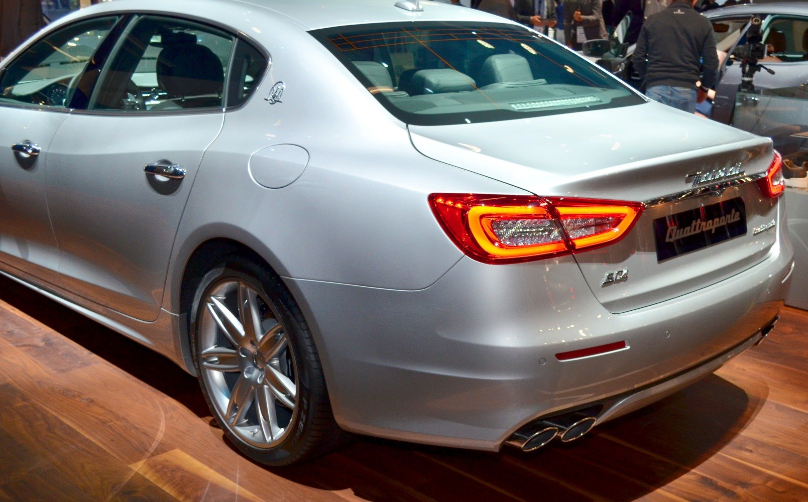 Luxury sedan rear with distinct LED taillights and dual exhaust system