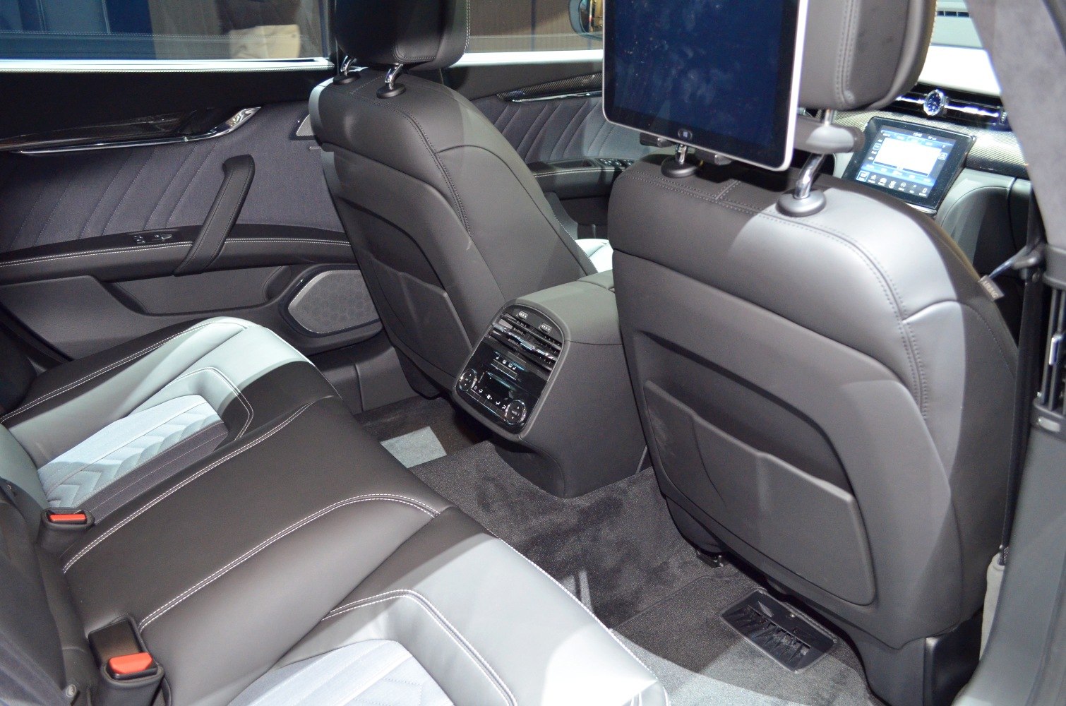 Luxury rear seating with entertainment screens and climate control
