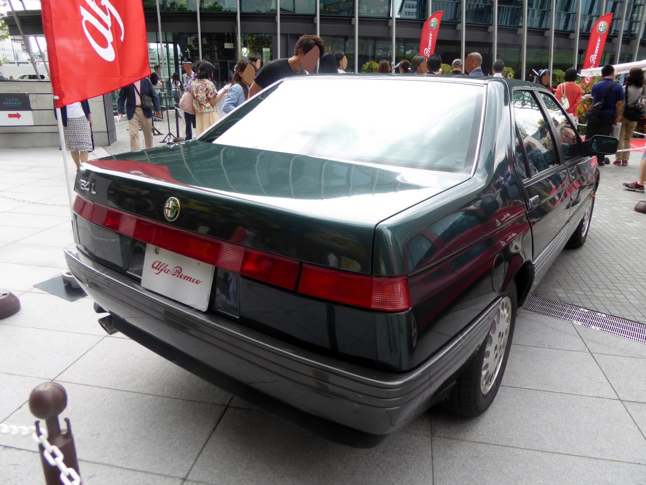 Rear view of a classic sedan with distinctive wide tail lights and angular design.