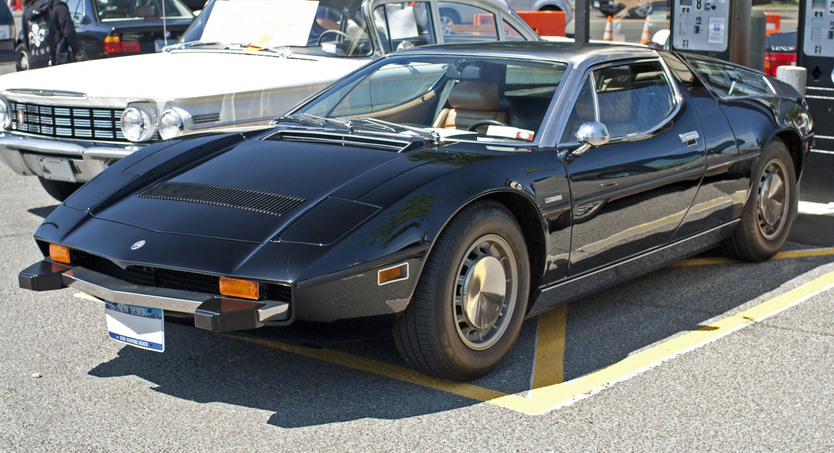 Sleek black mid-engine coupe with distinctive 1970s design.