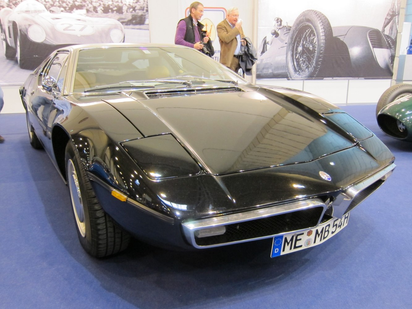 Classic car front with angular hood and pop-up headlights