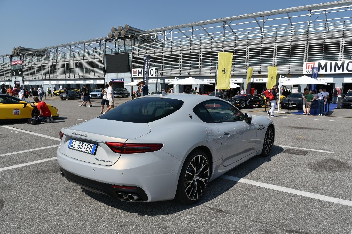 Rear and side view of a luxury sports coupe with LED taillights and quad exhaust