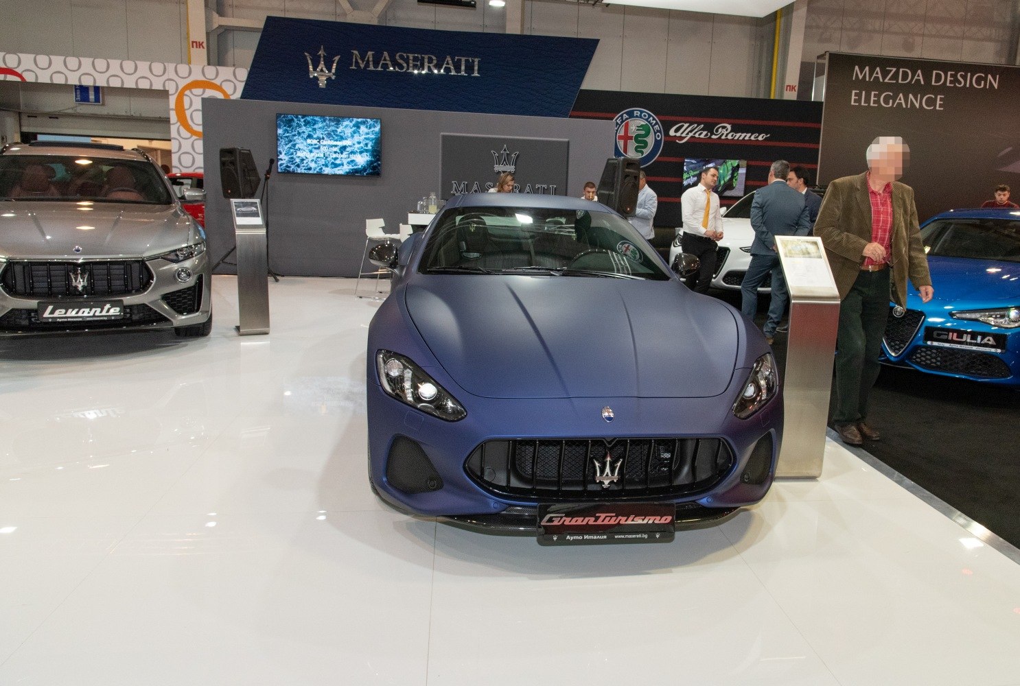 Front view featuring distinctive grille and sporty headlights