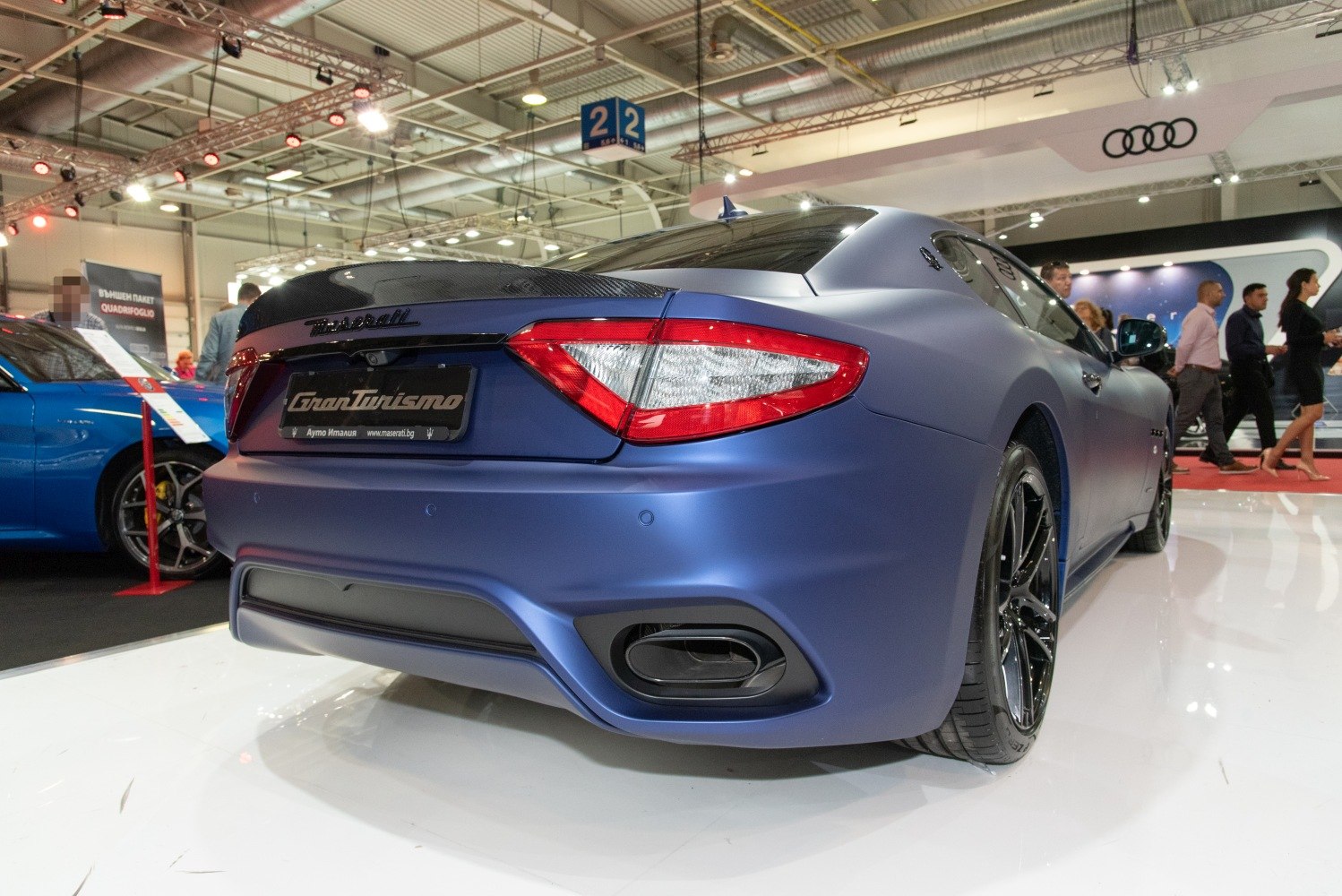 Rear view with distinctive taillights and sporty exhaust