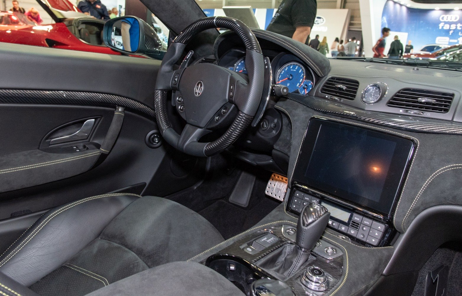 Luxury interior with carbon fiber and digital infotainment