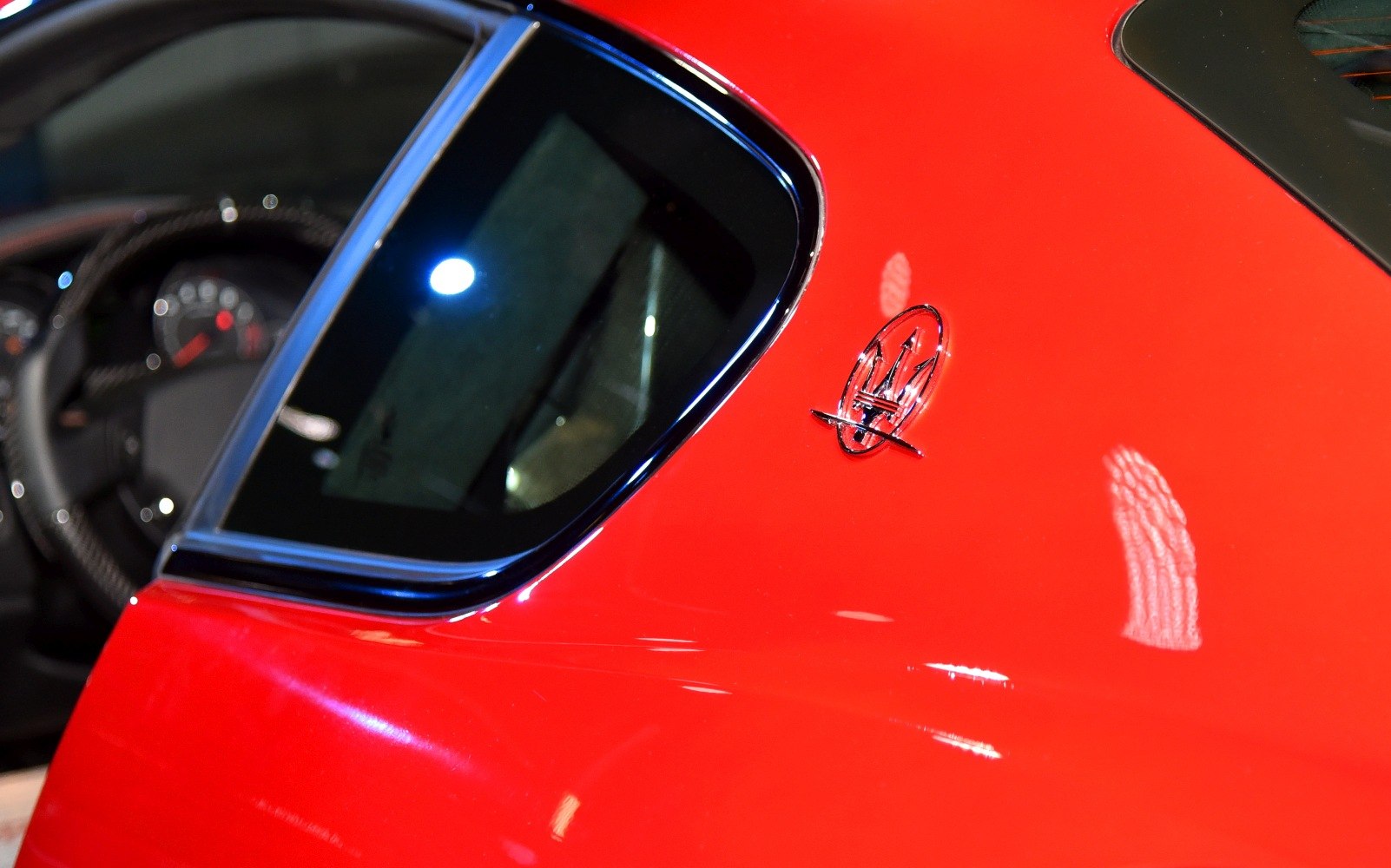 Close-up of side window and Maserati trident badge