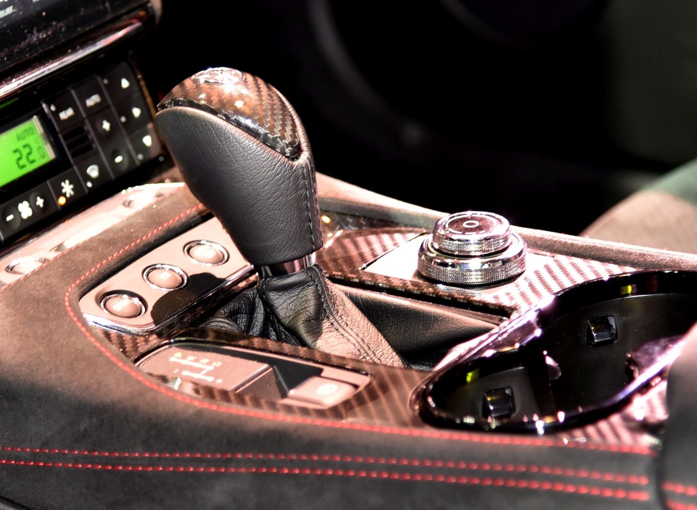 Carbon fiber gear shift lever and control dial with leather and red stitching