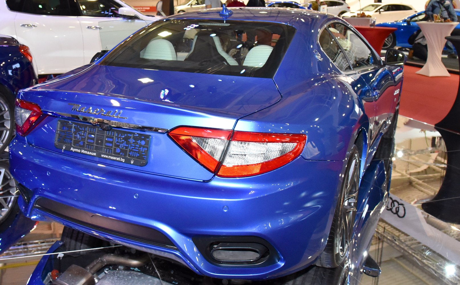 Rear view with distinctive tail lights and dual exhaust