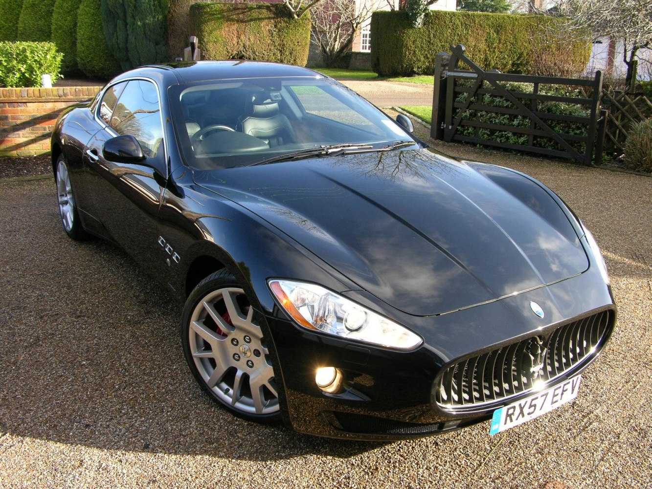 Sleek front angle view with iconic grille and sporty coupe profile