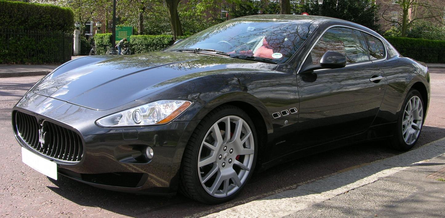 Black luxury coupe with distinctive front grille and stylish alloy wheels