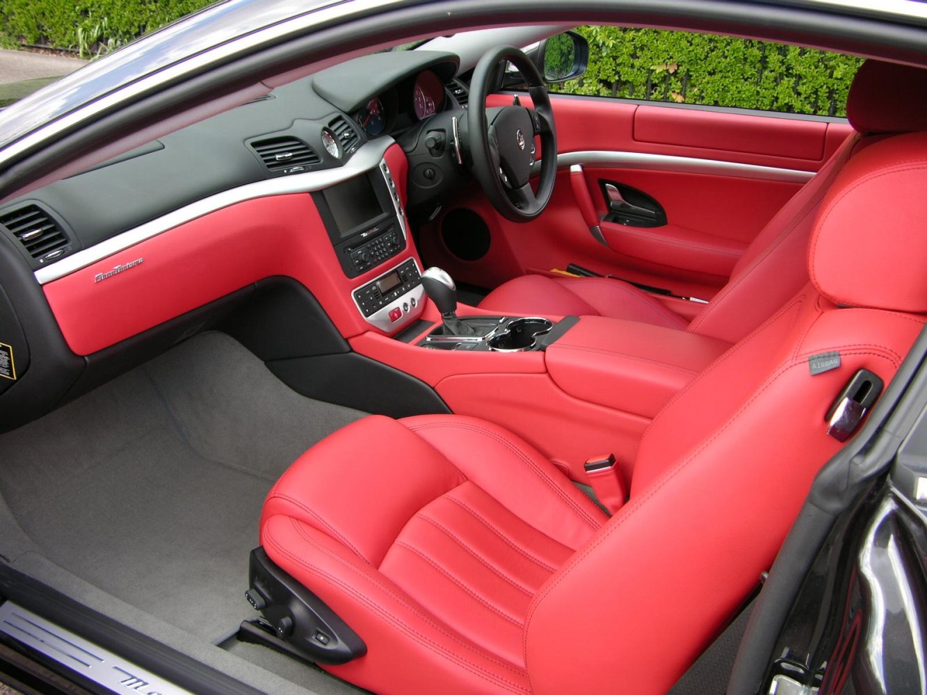 Red leather interior with advanced dashboard and center console