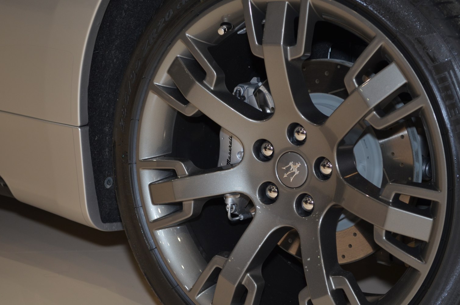 Alloy wheel with branded brake caliper and perforated brake disc