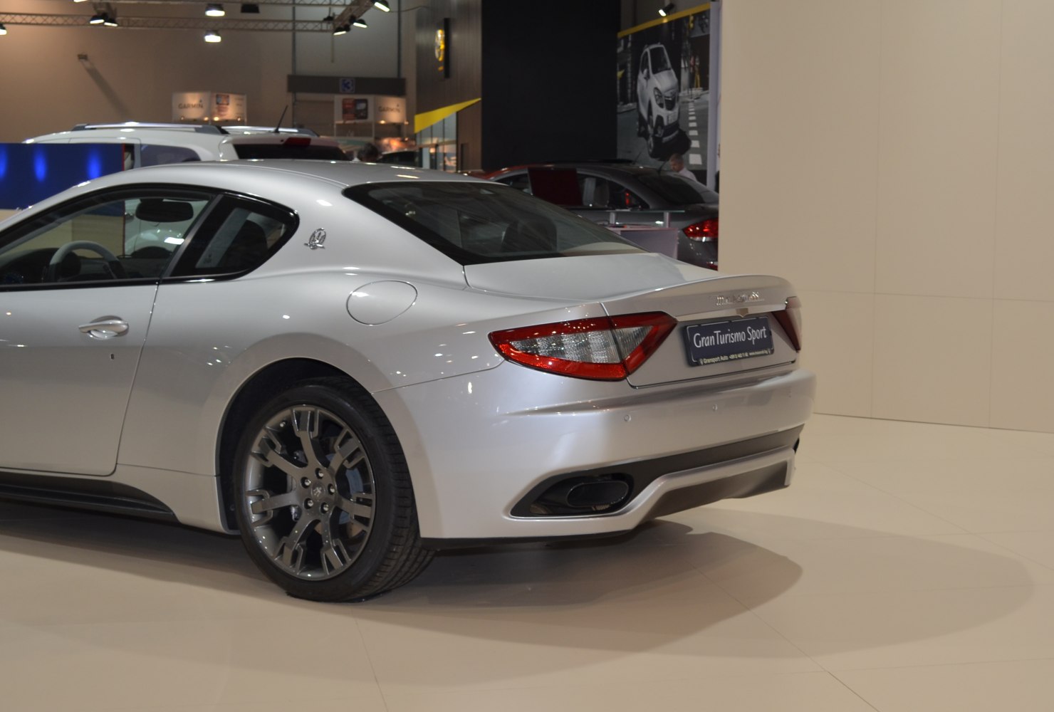 Rear tail lights and alloy wheel of a sleek sports coupe