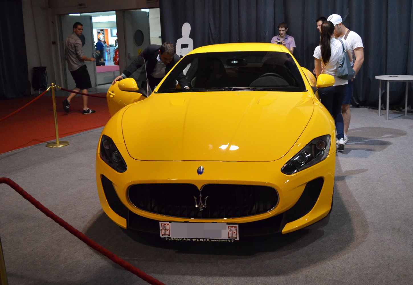 Yellow car front with distinctive grille and headlights