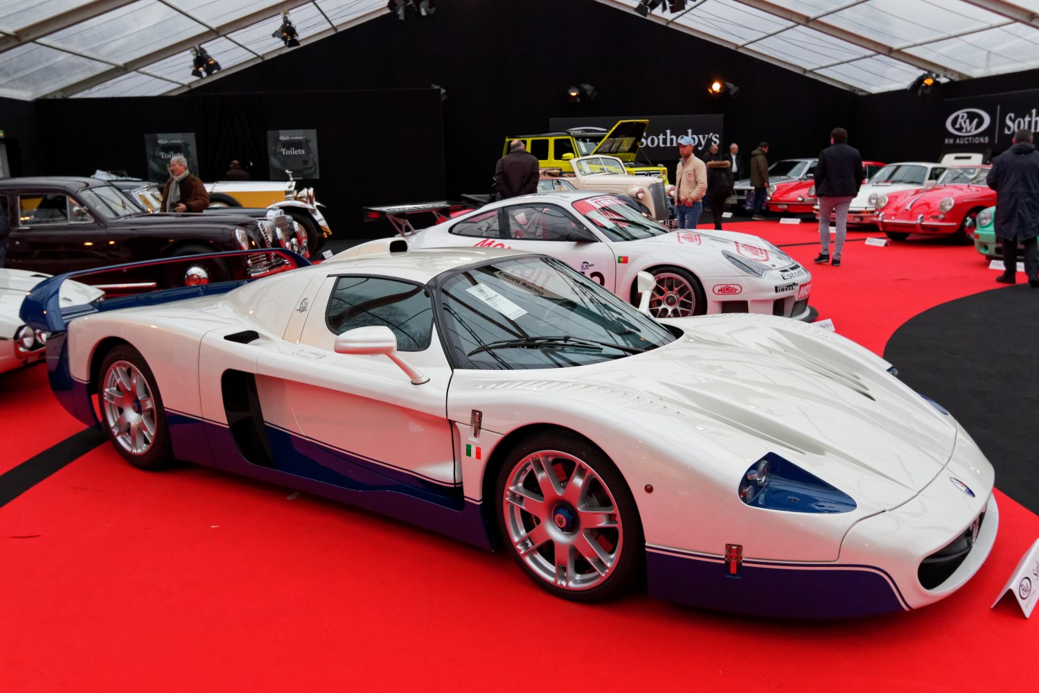 White and blue Maserati MC12 with aerodynamic shape and racing features