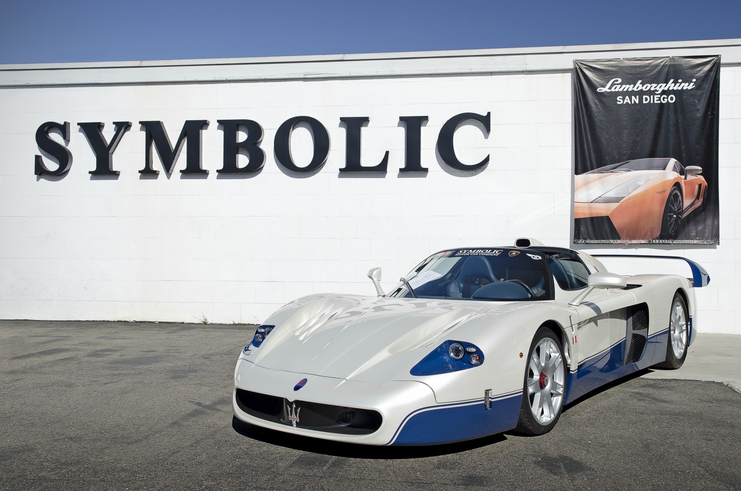 White blue aerodynamic supercar front and side view