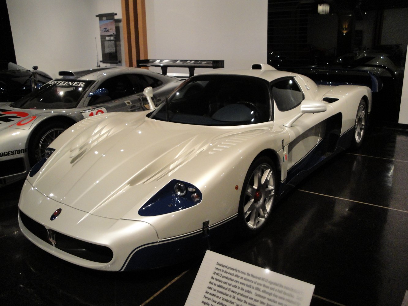 White racing supercar with aerodynamic body and large rear wing