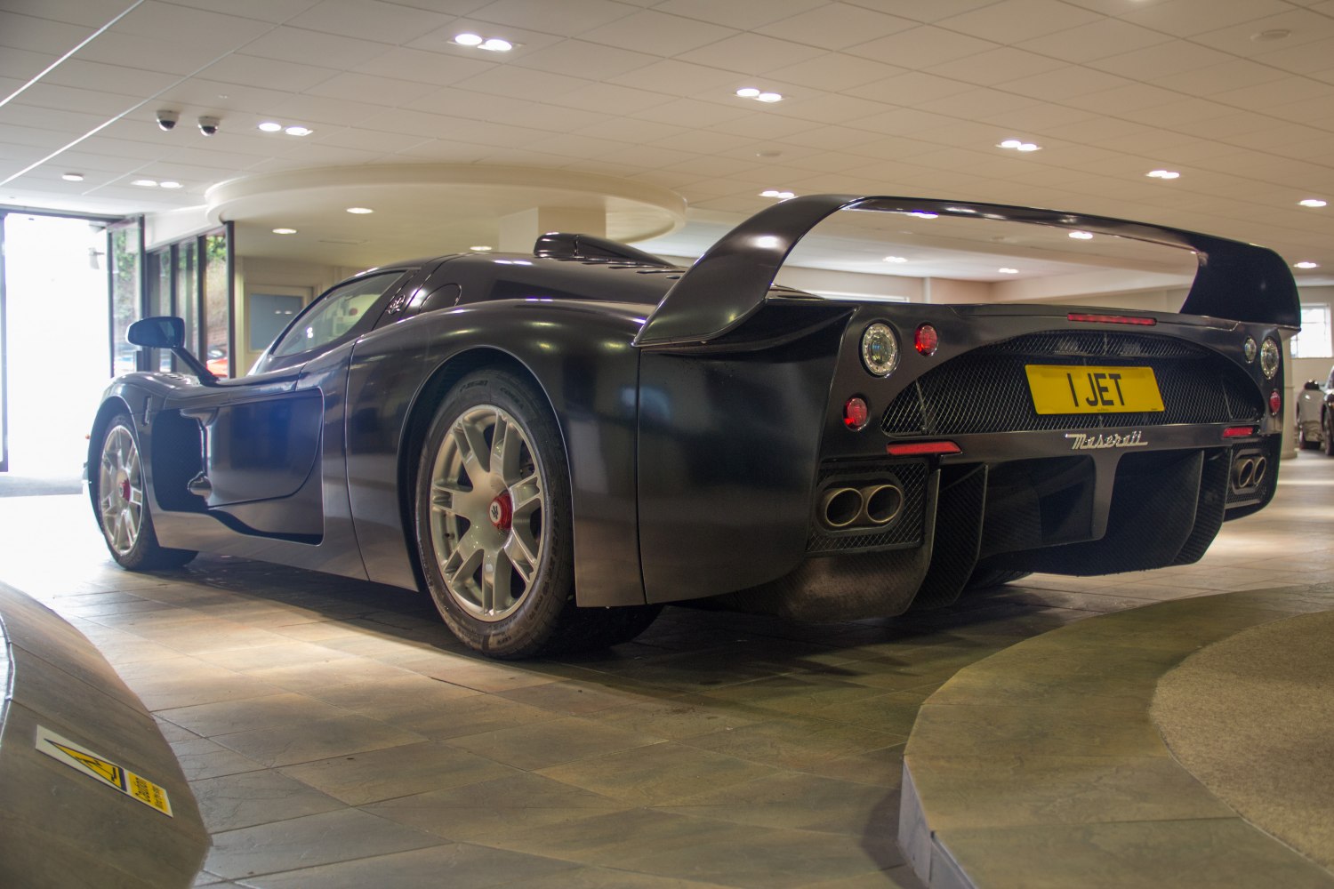 Rear view with large spoiler and quad exhaust tips