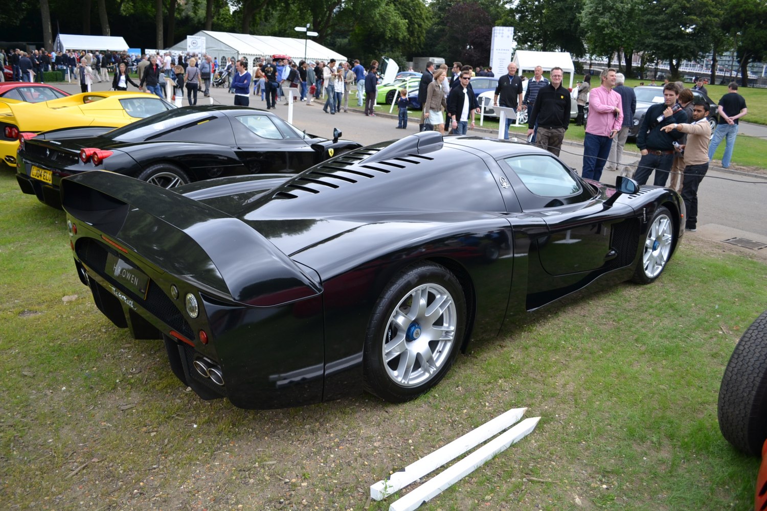 Sleek sports car with large rear wing and rear louvers