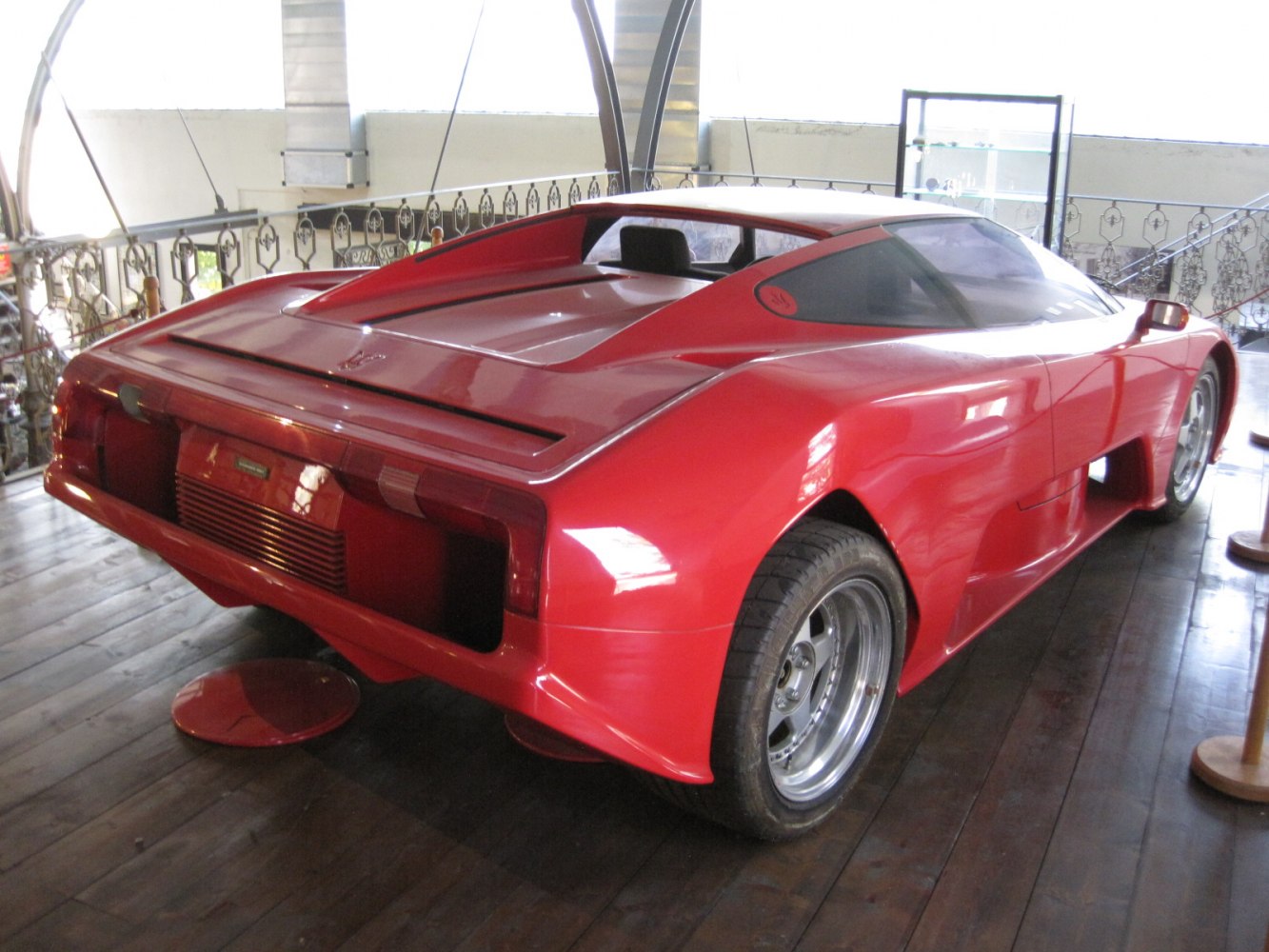 Red sports prototype with aerodynamic rear and wide tires