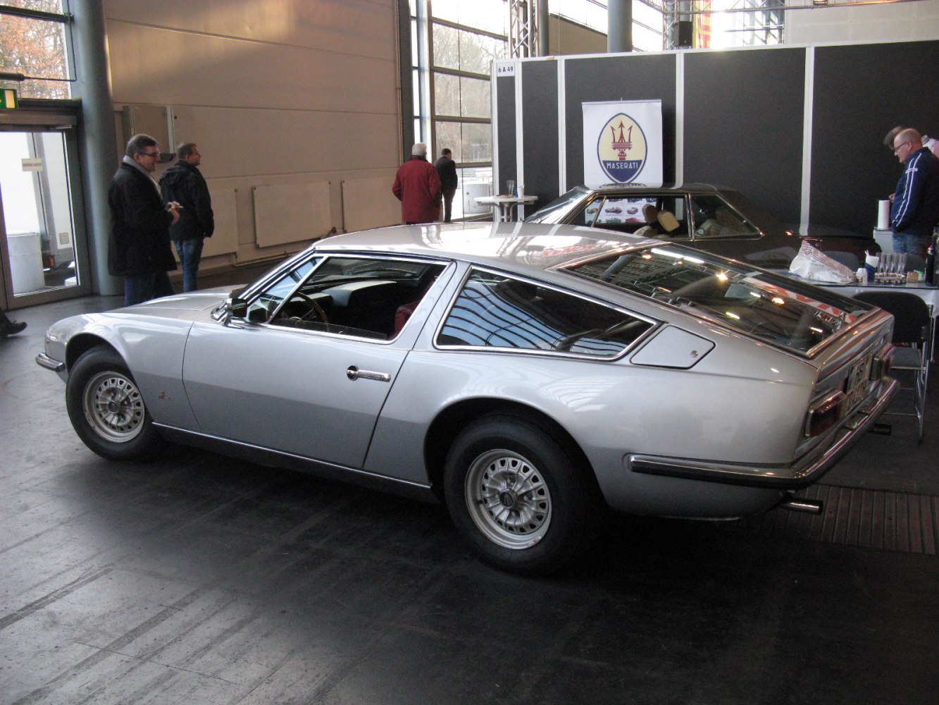 Vintage fastback coupe with rear window louvers and classic sporty profile