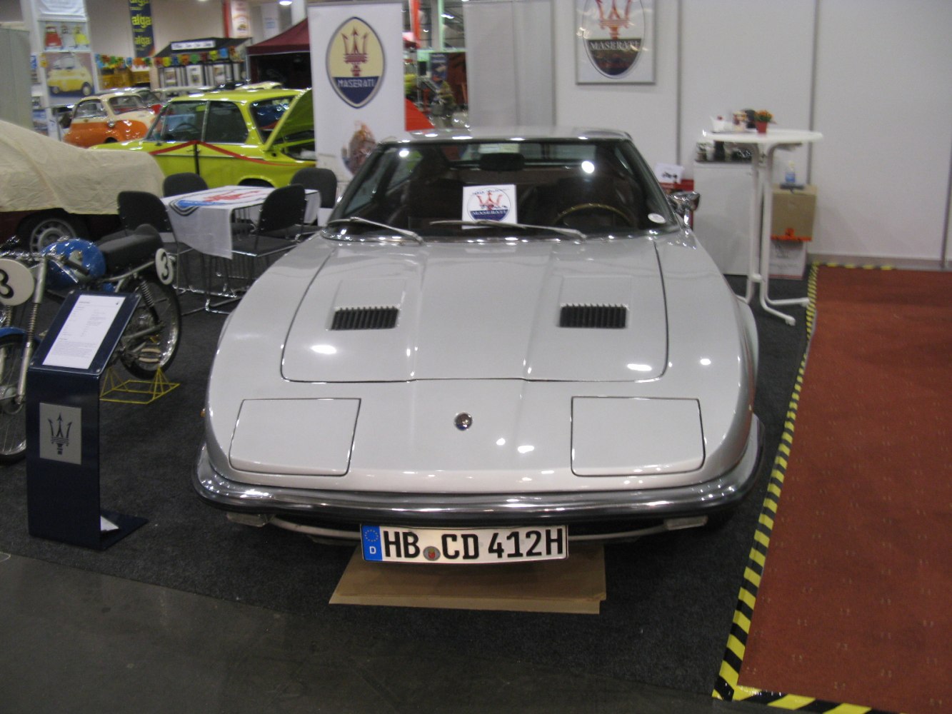 Classic front view with dual hood vents and pop-up headlights