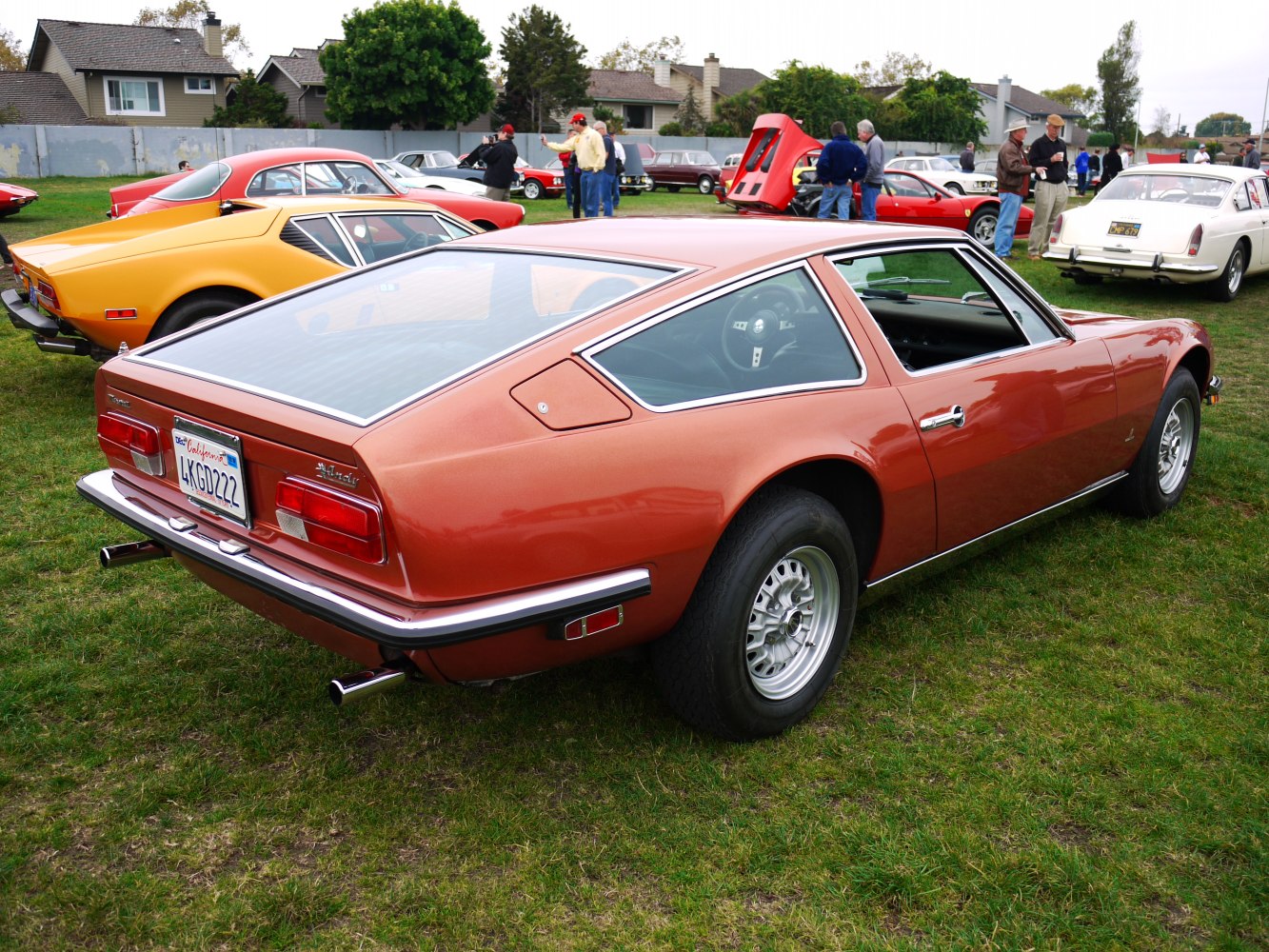 Vintage fastback coupe rear view with large glass hatch and chrome trim