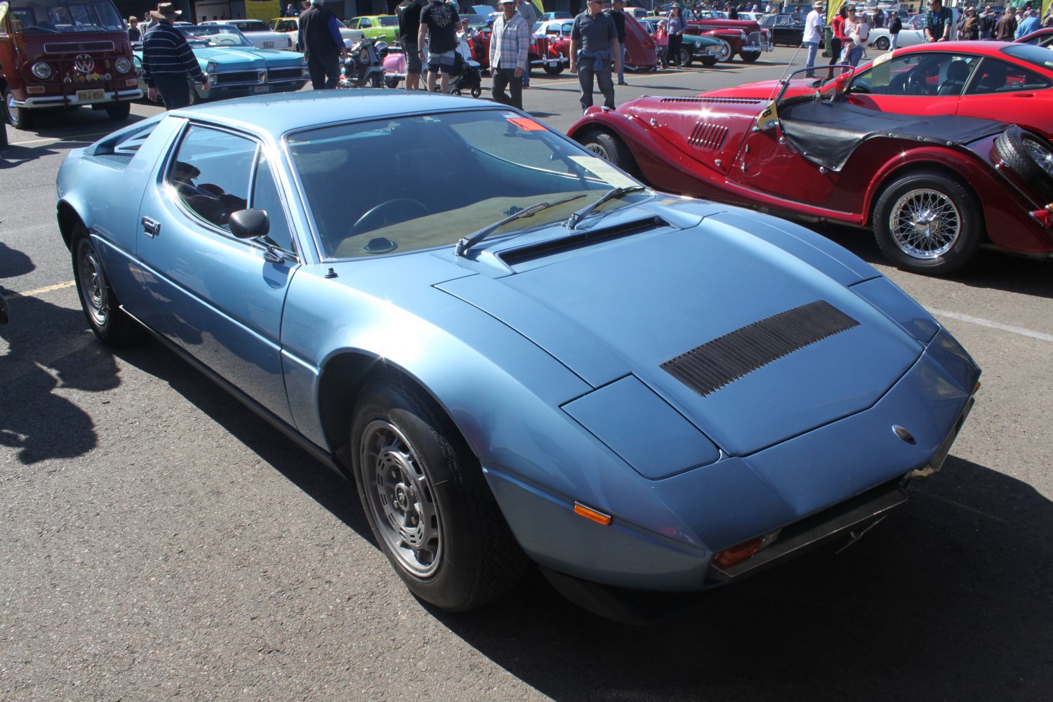 Blue 1970s sports coupe with angular design and front air vents