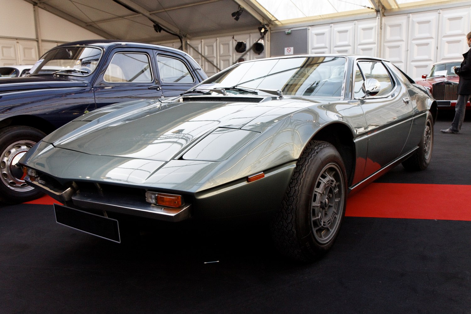 Wedge-shaped front end with pop-up headlights and alloy wheels.