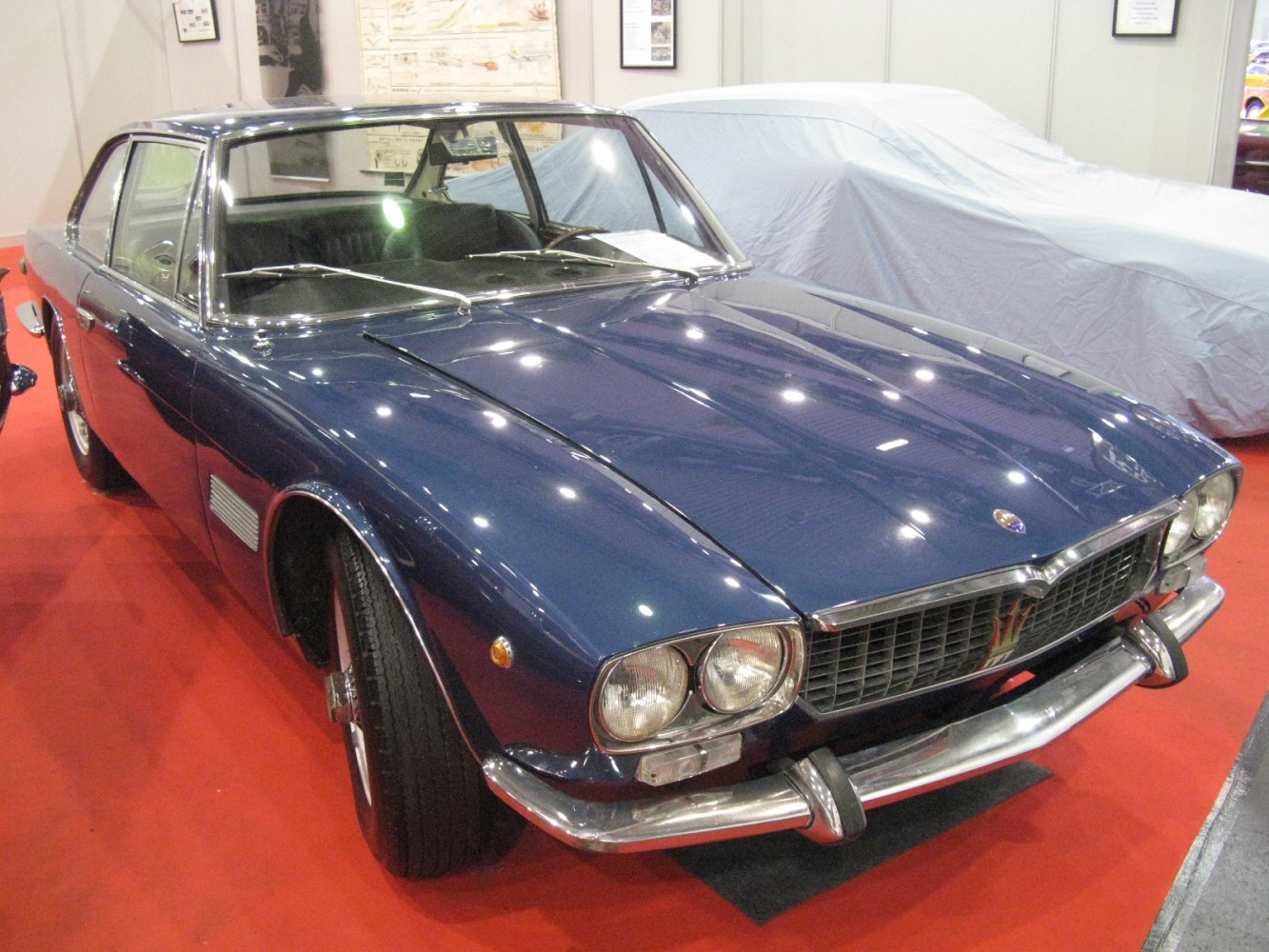 Front exterior with dual headlights and chrome bumper