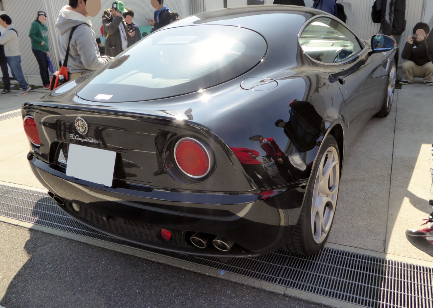 Rear view focusing on round tail lights and dual exhausts