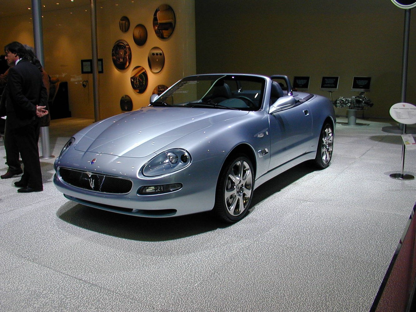 Silver convertible with sleek body and distinctive headlights
