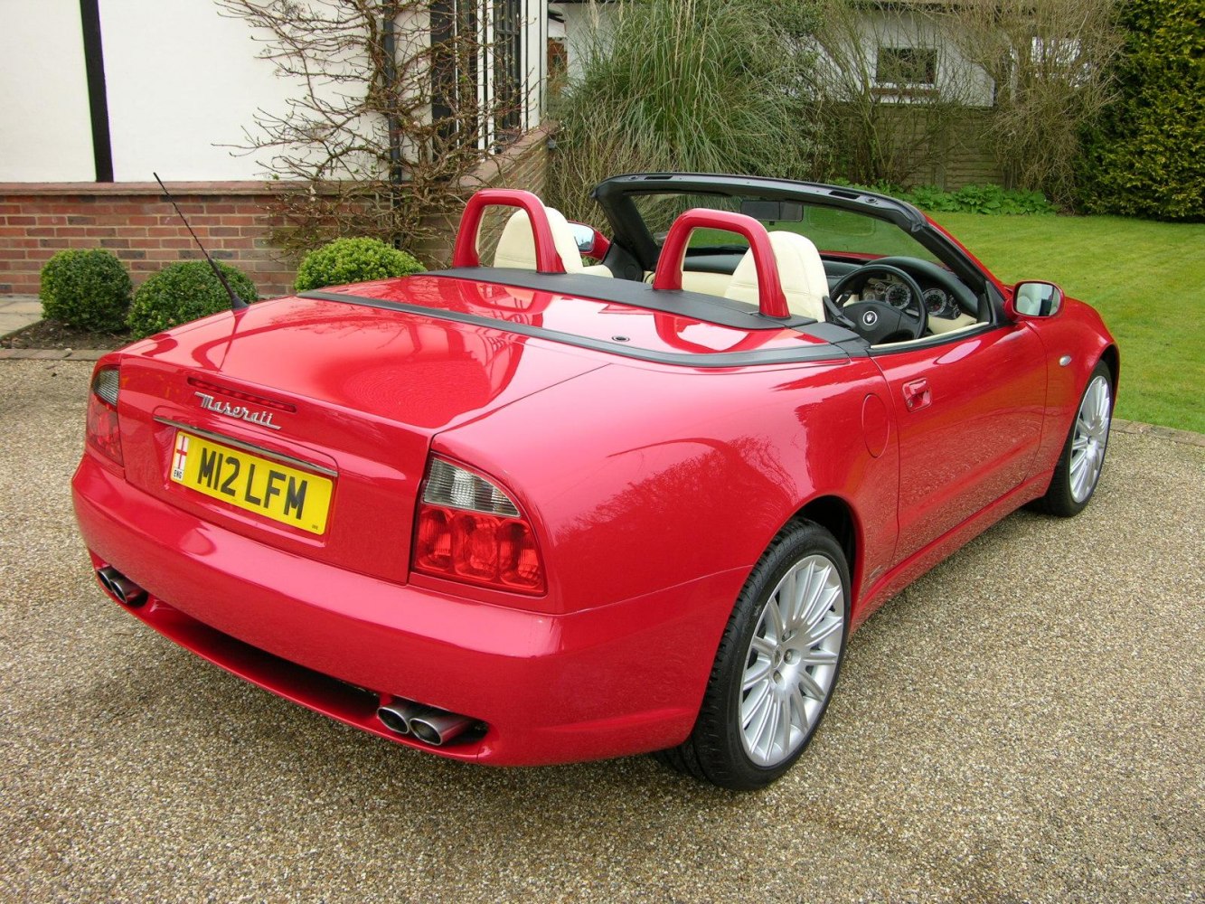 Convertible Spyder with quad exhaust and dual roll bars