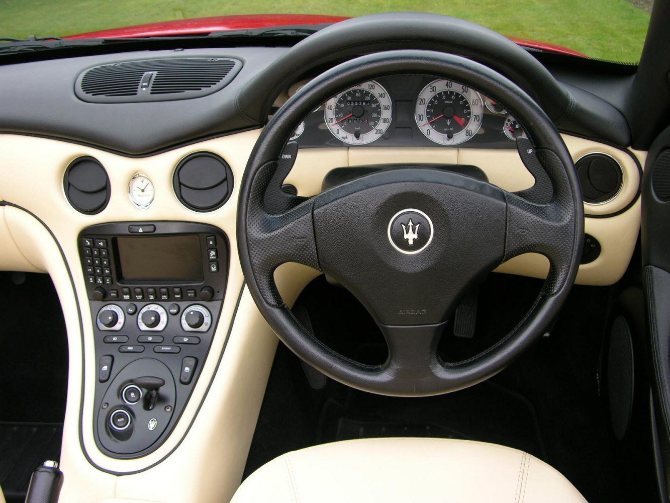 Steering wheel with emblem and dashboard center console